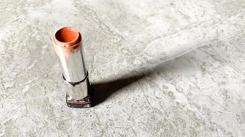 Empty lipstick tube on countertop