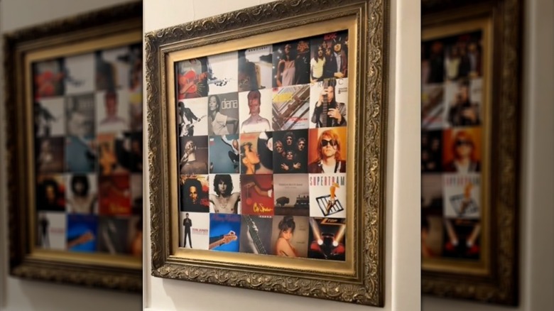 Framed album art from CDs in an elegant gold frame on the wall