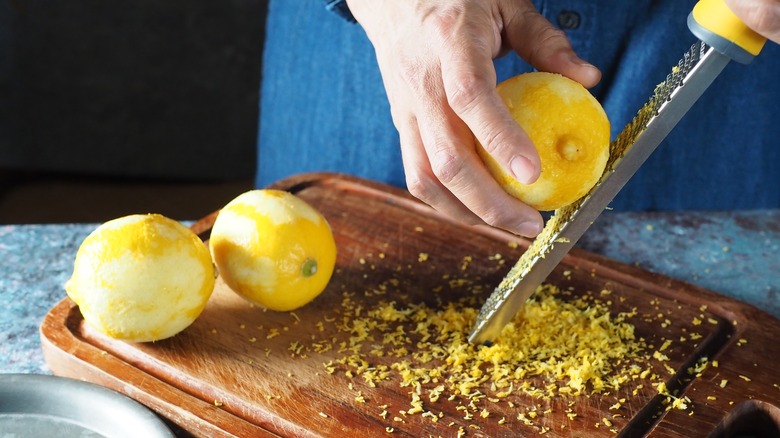 hand grating lemon peel