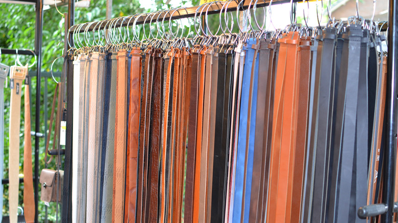 belts hanging from metal hoops 