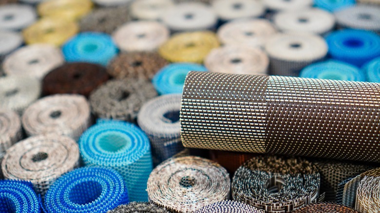 Rolls of shelf liner in different colors in a box