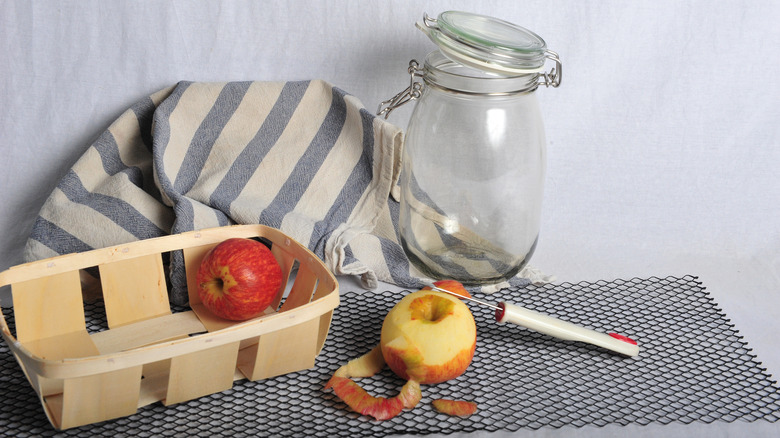 jar with apples to peel