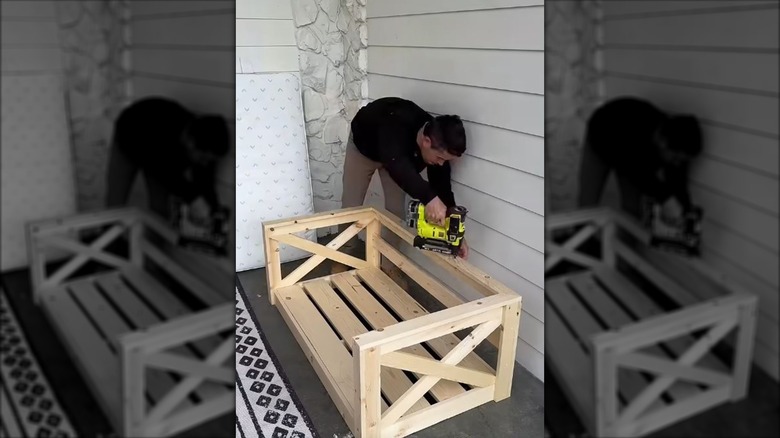 Man building a porch swing