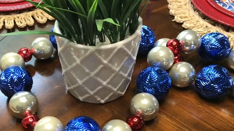 Blue, white, and red garland on a table