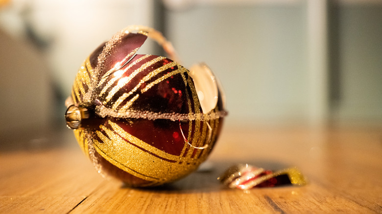 A broken Christmas ornament on the ground