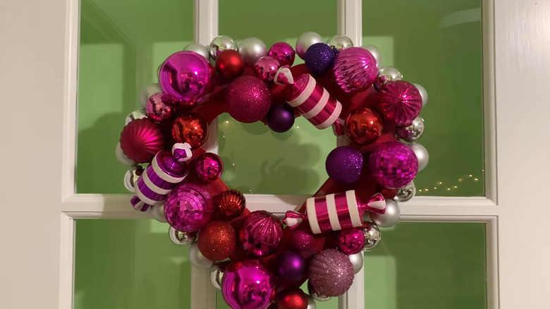 Decorative heart-shaped Valentine's Day wreath made with Christmas ornaments