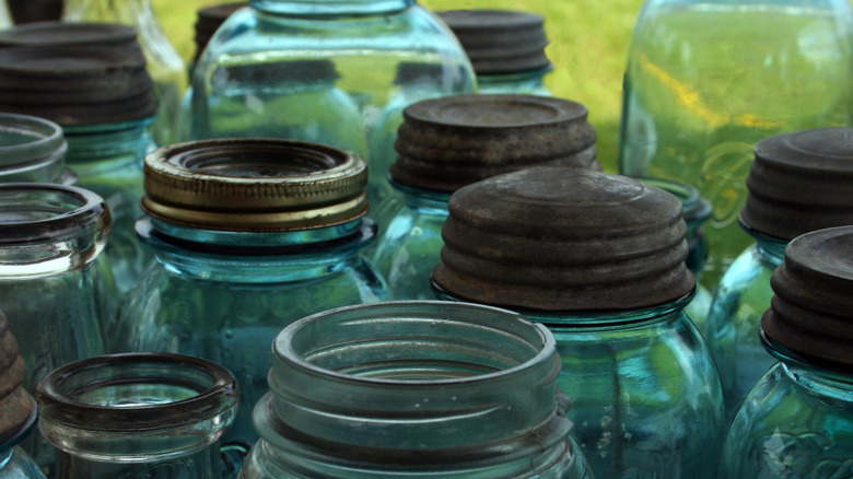 many rusty mason jar lids