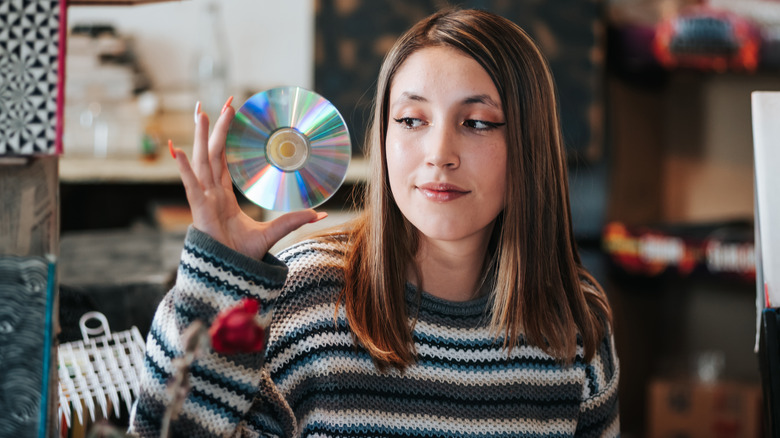 Someone holding a CD