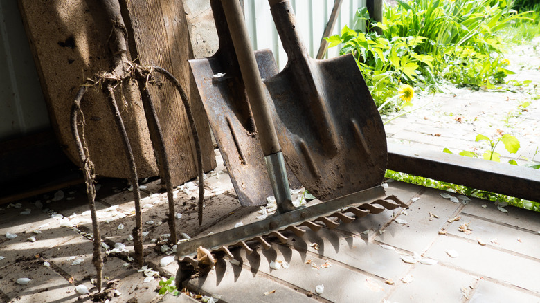 Different tools leaning against a wall