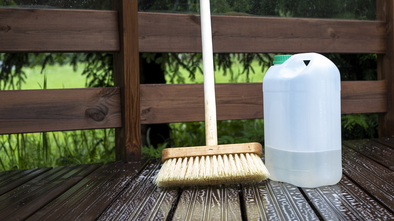 Push broom and vinegar on deck