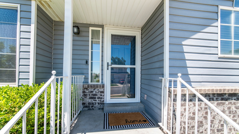 Front door with a storm door protecting it