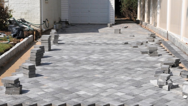 A concrete paver driveway being installed