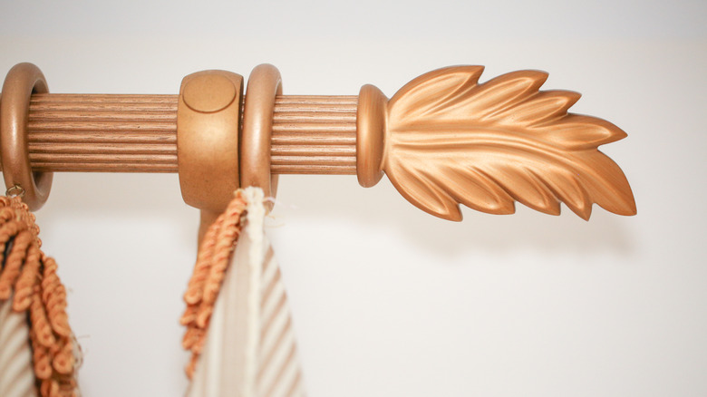 Close-up of a wood curtain rod