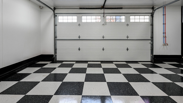 Garage with checkerboard flooring