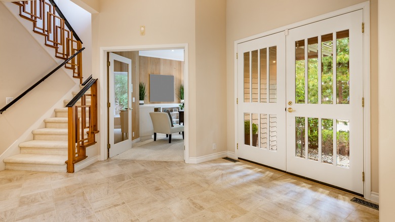 Entryway of house with mixed flooring