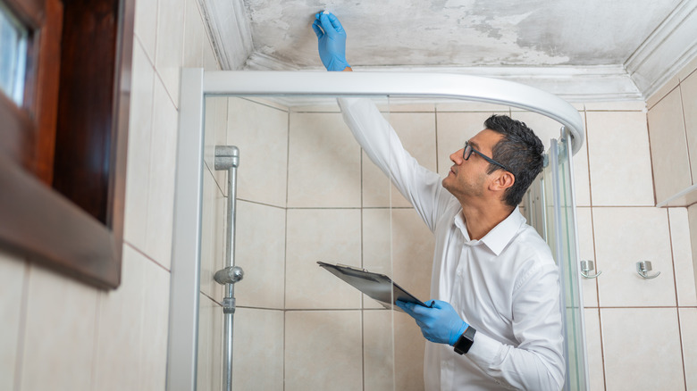 person cleaning drywall ghosting 