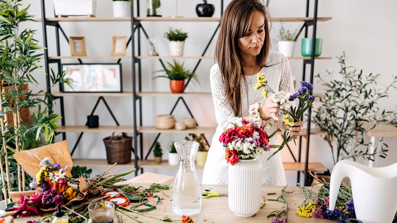 woman arranging flowers