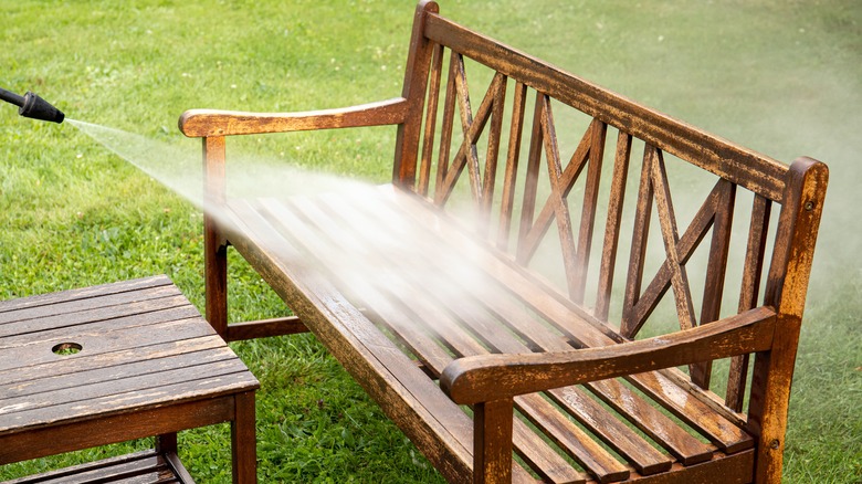 Pressure washing wooden bench