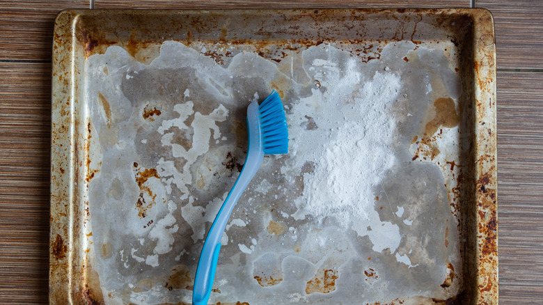 dirty baking sheet cleaning brush