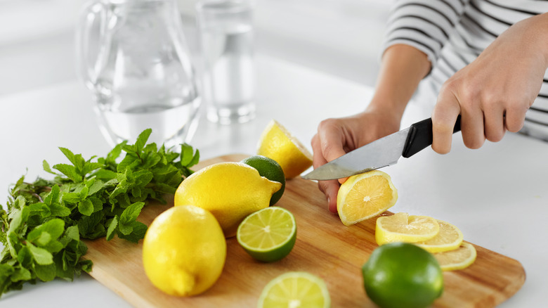 Person cutting lemon slices