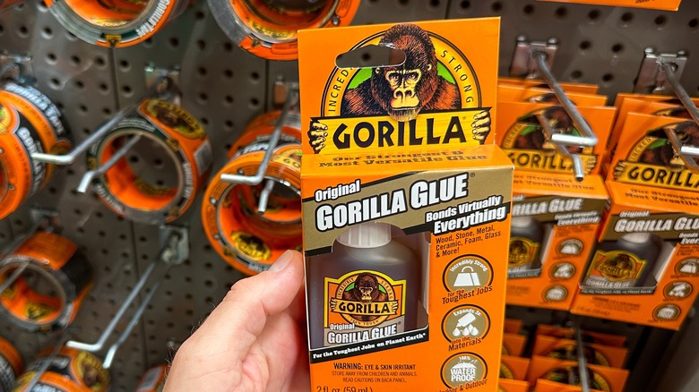 A person holds a bottle of Gorilla Glue