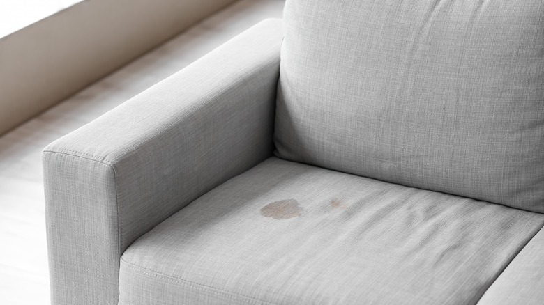 Red stain on couch