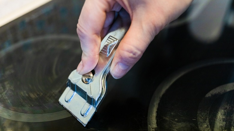 Razor scraping ceramic stovetop