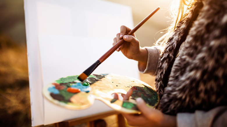 Person using a paint palette