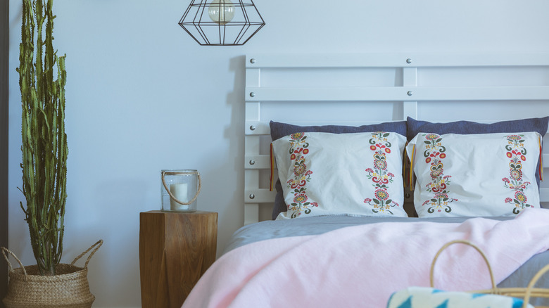 white room with white headboard 