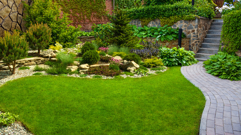 beautiful landscaped yard brick path