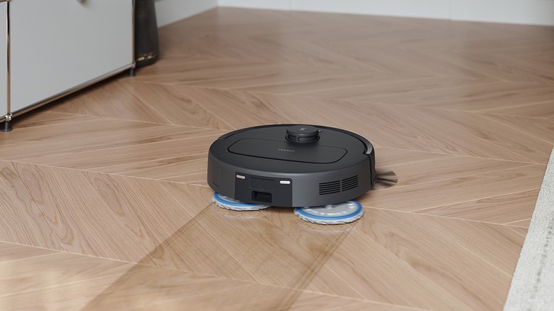 Robot vacuum mopping wood floor