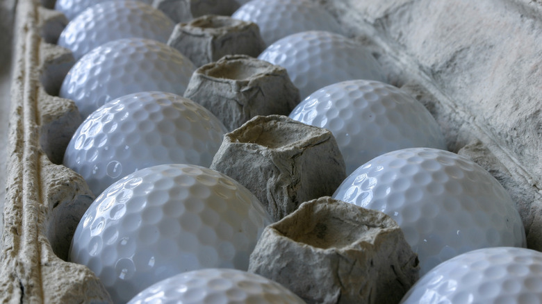 Golf balls in egg cartons