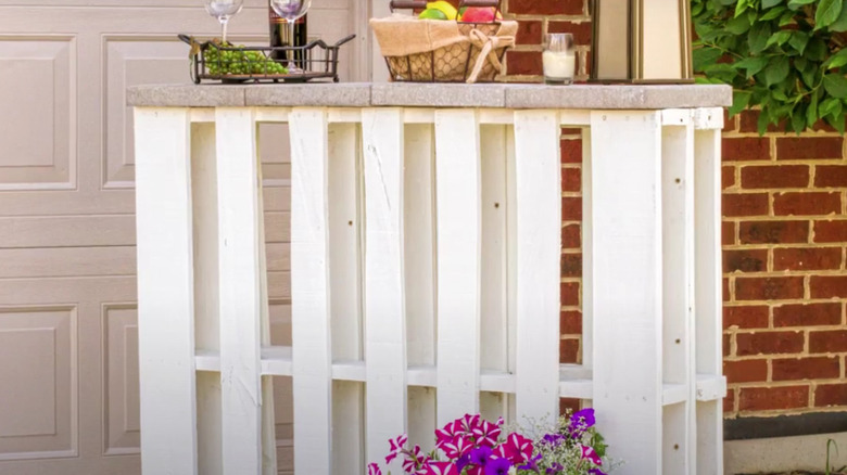 A finished pallet bar is on a patio