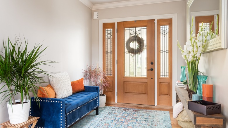 Foyer with blue couch