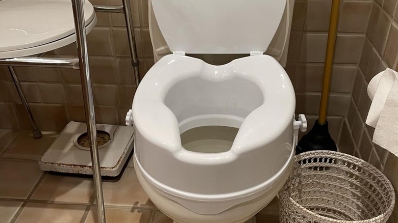 elevated toilet seat in bathroom