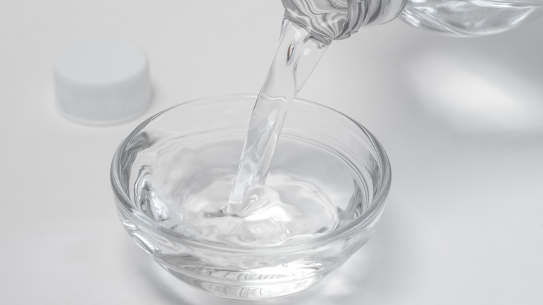 Vinegar being poured into bowl