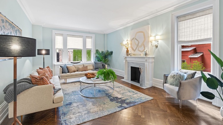 living room with bay windows and fireplace