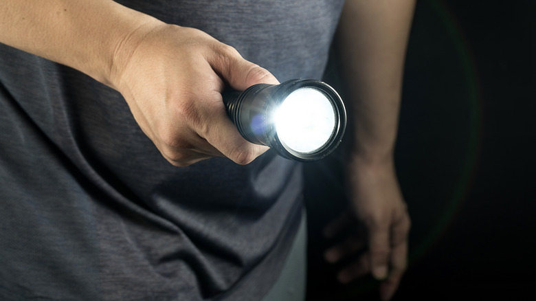 Man holding a flashlight