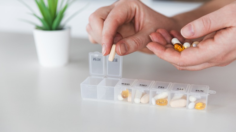 Putting medications in pill boxes