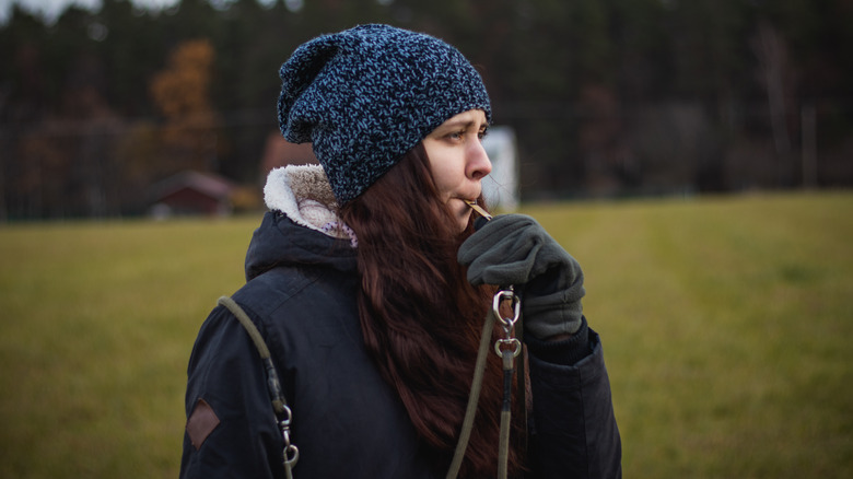 Woman blowing a whistle