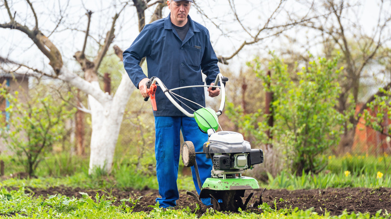 man using garden tool