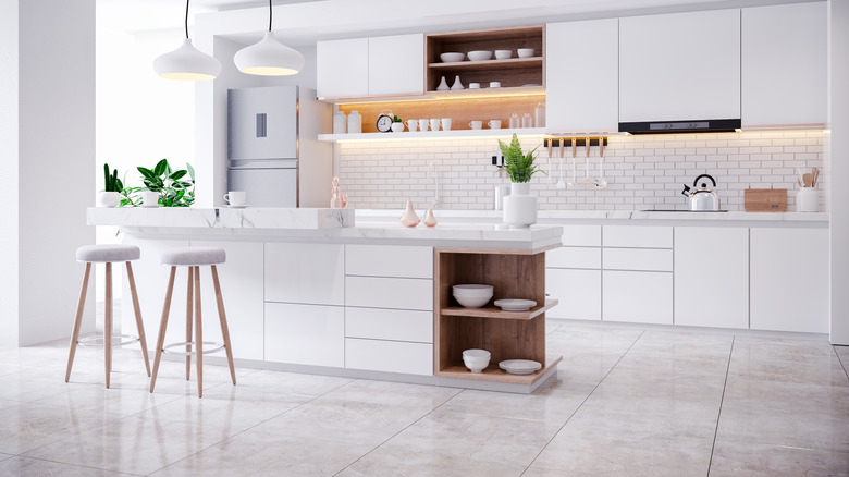 Modern white kitchen with tile floors