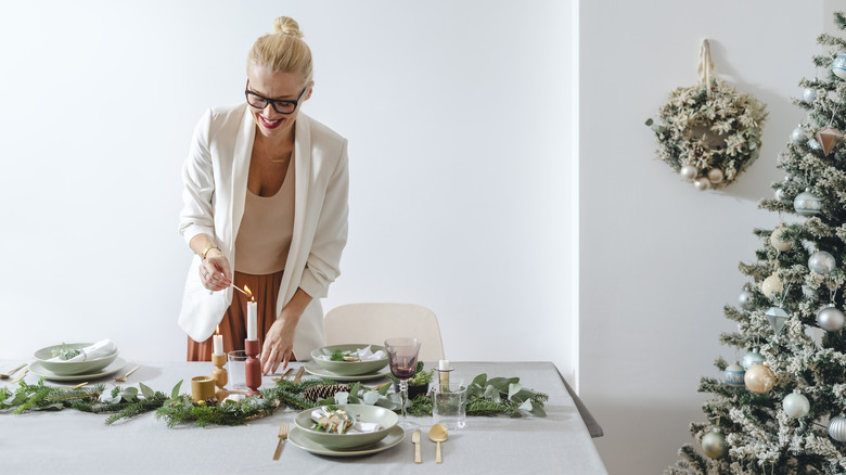 Woman decorates holiday table