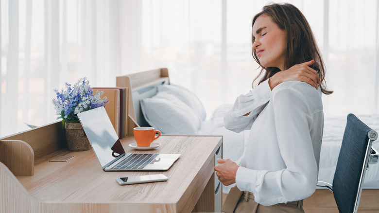 woman working in uncomfortable chair