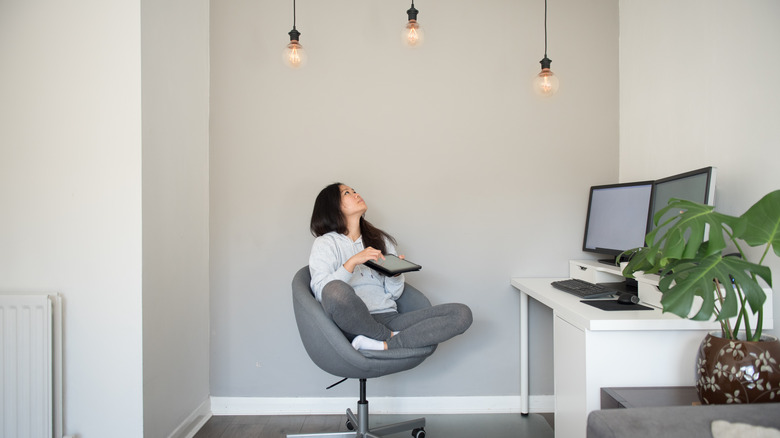 working woman adjusts LED lights