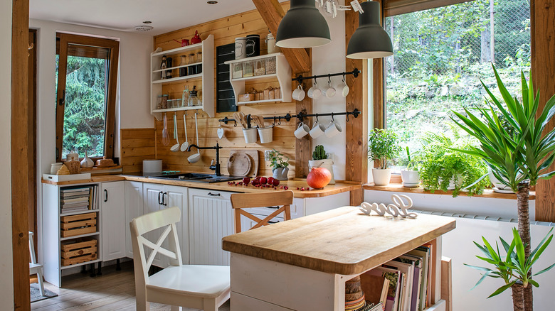 A small but functional kitchen is decorated with wood