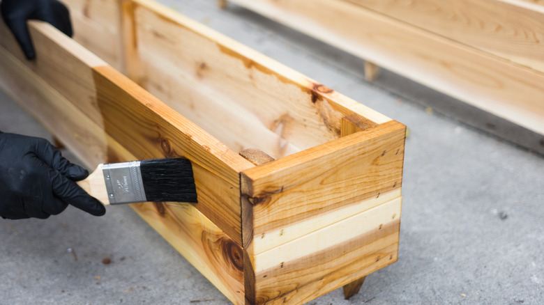 Brush on wooden planter