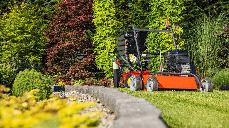 A lawn aerator in a yard