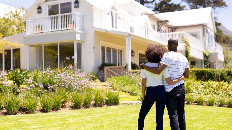 couple looking at their home