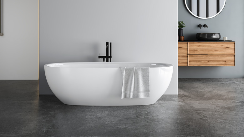 Bathroom with finished concrete floor